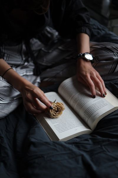 Close-up of hands in a meditative pose, focus on the details.